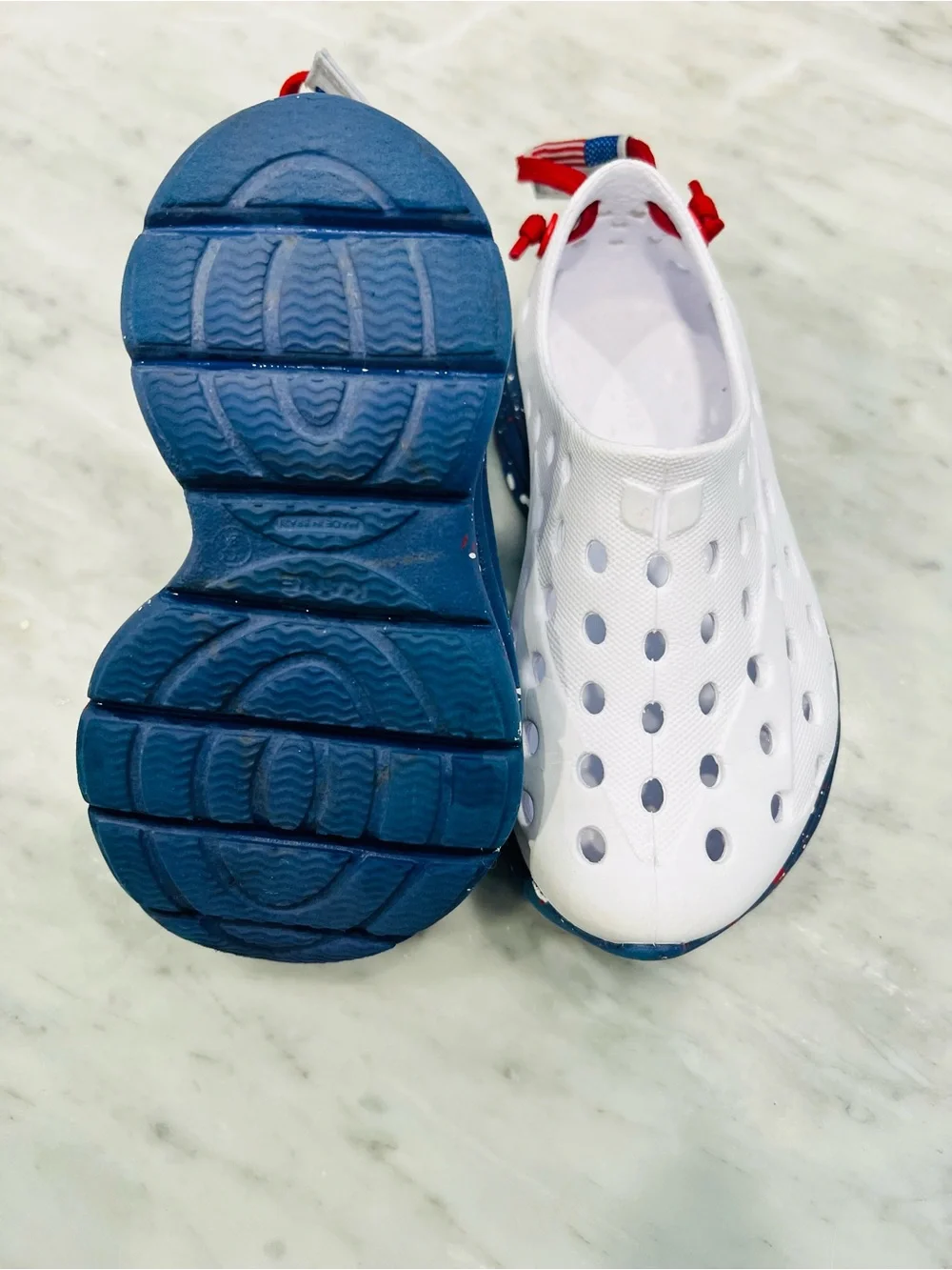 Kids White Slip-On Water Shoes with Navy Speckled Sole and Red Pull Tab